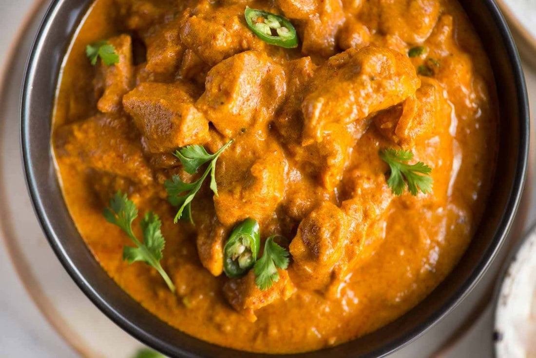 A slow cooker one-pot chicken dish, deeply seasoned and ready to serve
